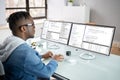African American Coder Using Computer At Desk Royalty Free Stock Photo