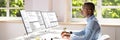 African American Coder Using Computer At Desk Royalty Free Stock Photo