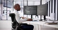 African American Coder Using Computer At Desk Royalty Free Stock Photo