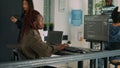 African american coder writing programming language on computer Royalty Free Stock Photo
