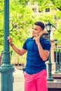 Young man talking on cell phone outdoors in New York City Royalty Free Stock Photo