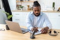 African American confident businessman using laptop computer working from home Remote work concept Royalty Free Stock Photo