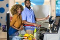 African American Couple with bank card buying food at grocery store or supermarket self-checkout Royalty Free Stock Photo