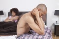 African American couple in bedroom ignoring each other Royalty Free Stock Photo