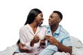 African american couple drinking coffee in bed in pajamas isolated on white Royalty Free Stock Photo