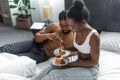 african american couple eating delicious pancakes on breakfast