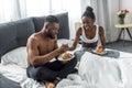 african american couple eating pancakes
