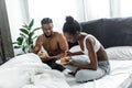 african american couple eating pancakes at breakfast