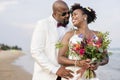 African American couple getting married at an island