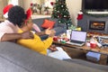 African american couple having face time and using laptop with copy space Royalty Free Stock Photo