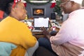 African american couple having face time and using laptop with copy space Royalty Free Stock Photo