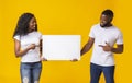 African american couple holding white advertising board Royalty Free Stock Photo