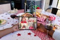 African american couple making tablet christmas video call with four smiling caucasian girls Royalty Free Stock Photo