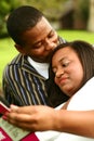 African American Couple Reading Book Outdoor Royalty Free Stock Photo