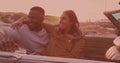 African american couple smiling and enjoying in the car during a roadtrip Royalty Free Stock Photo
