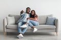 African American couple spending weekend together watching tv Royalty Free Stock Photo