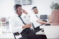 African american customer support operator with hands-free headset working in the office Royalty Free Stock Photo