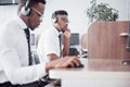 African american customer support operator with hands-free headset working in the office Royalty Free Stock Photo