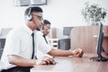 African american customer support operator with hands-free headset working in the office Royalty Free Stock Photo