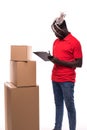 African american delivery man carrying parcel and presenting receiving form isolated on white background Royalty Free Stock Photo