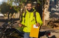 African american delivery man with envelope and delivery check sheet Royalty Free Stock Photo