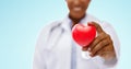 African american doctor hand holding red heart Royalty Free Stock Photo