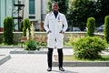 African american doctor male at lab coat with stethoscope outdoor Royalty Free Stock Photo