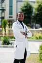 African american doctor male at lab coat with stethoscope outdoor Royalty Free Stock Photo