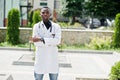 African american doctor male at lab coat with stethoscope outdoor Royalty Free Stock Photo