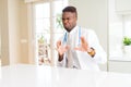 African american doctor man at the clinic disgusted expression, displeased and fearful doing disgust face because aversion