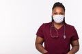 African american doctor in a medical mask over white background with copy space. Medicine, healthcare and people concept