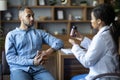 African american doctor showing black guy patient drugs