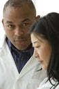 African American doctor talking with Female Asian doctor Royalty Free Stock Photo