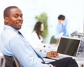 African American entrepreneur displaying computer laptop in office Royalty Free Stock Photo