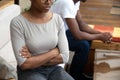 African couple sit apart turn back after fight, closeup view Royalty Free Stock Photo