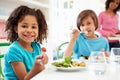 African American Family Eating Meal At Home Together Royalty Free Stock Photo