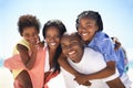 Our parents are so strong. An african-american family enjoying a day at the beach together. Royalty Free Stock Photo