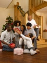 African American family exchanging Christmas gifts Royalty Free Stock Photo