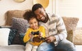 African american family gamers playing on console