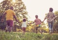 African American family having fun outdoors. Family running trough park Royalty Free Stock Photo