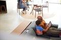 African American Family At Home With Father And Son Sitting On Sofa At Home Using Digital Tablet Royalty Free Stock Photo