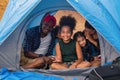 African american family, parent with kids, and asian adoped child having fun together in camping at natural park Royalty Free Stock Photo