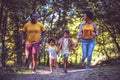 Family running trough park Royalty Free Stock Photo