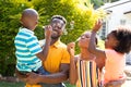 African American family spending time together in their garden. Royalty Free Stock Photo