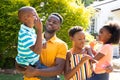 African American family spending time together in their garden. Royalty Free Stock Photo