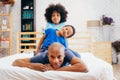 African American family of three, kids sitting on father`s back Royalty Free Stock Photo
