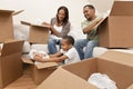 African American Family Unpacking Moving Boxes Royalty Free Stock Photo