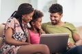 African american family using laptop at home Royalty Free Stock Photo