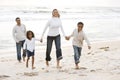 African-American family walking on beach Royalty Free Stock Photo