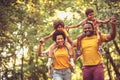 African American family walking trough park. Royalty Free Stock Photo
